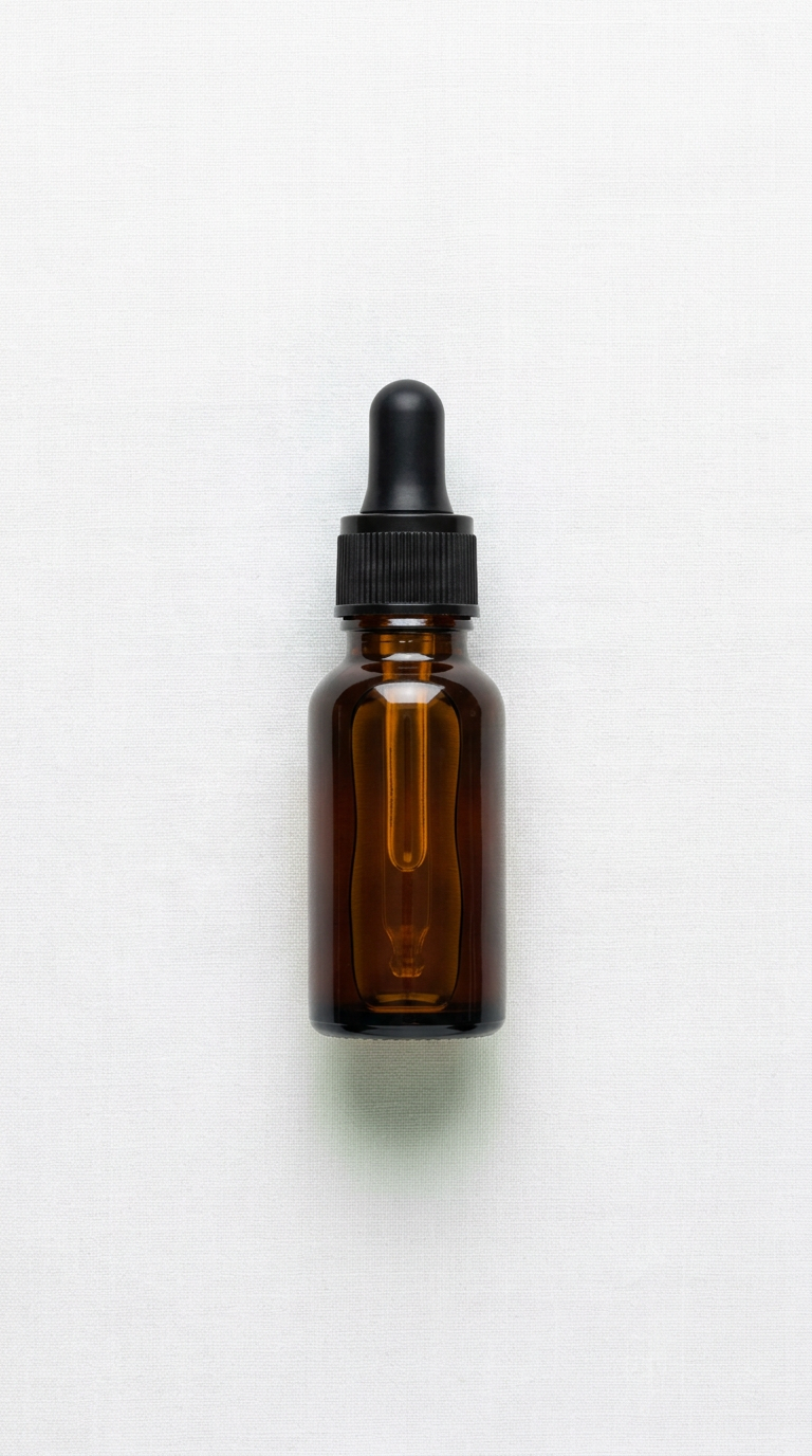 Hair growth oil travel-size bottle